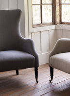 Fauteuil à oreilles Bromley, lin gris (pieds noirs)